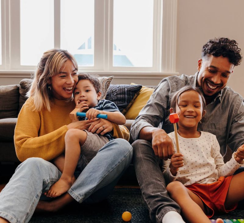 happy family playing in living room