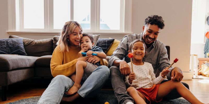 happy family playing in living room